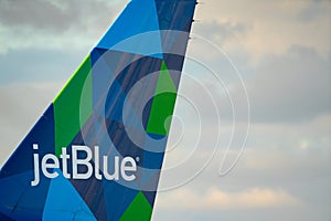 Photo of a jetblue airplane tail with company logo