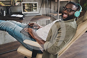 Photo of joy designer guy security safety support worker sit chair typing html page java script outsource in workspace