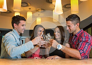 Photo of joyful friends in the bar communicating with each other