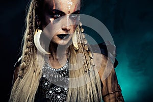 Photo of lady celebrate halloween event dressed in shield maiden viking queen over mist light effect background
