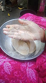 Photo of lady hand with atta