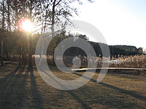 Photo with landscape background of sunset on the lake in Lithuania