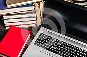 Photo of laptop with antique books