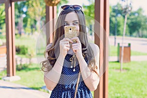 Photo of laughing funny funky pondering thinking over her plan pensive interested model holding telephone in hands closing face