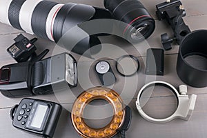 Photo lenses and equipment on wooden table