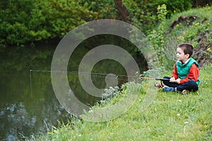 Photo of little boy fishing