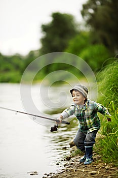 Photo of little boy fishing