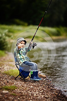 Photo of little boy fishing