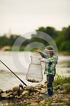 Photo of little boy fishing