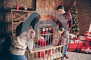 Photo of little boy infant sleep in bed parents sister sing lullaby decoration atmosphere new year indoors
