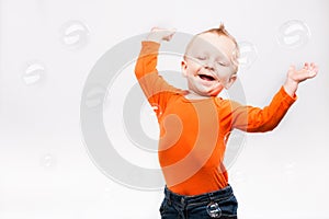 Photo of little boy, playing with soap b