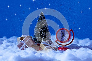 Photo of little red clock show soon will christmas eve time midnight santa claus hurry deliver brown yellow gift boxes