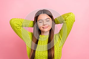 Photo of lovely calm girl closed eyes arms behind head take nap isolated on pink color background