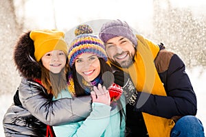 Photo of lovely family happy positive smile hug cuddle embrace enjoy time together winter snowy day outdoors