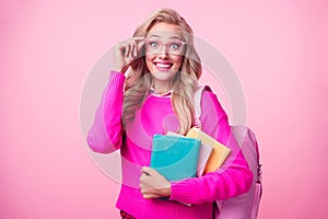 Photo of lovely intelligent girl curly hairstyle hands touch eyewear hold literature go library isolated on pink color