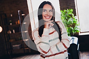 Photo of lovely young woman look minded empty space wear striped outfit interior home living room in brown warm color