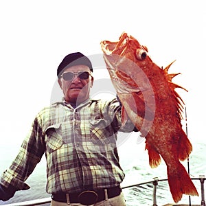 Man With Big Orange Yelloweye Rockfish