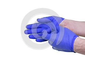 A photo of man doctor putting on protective gloves, isolated on white.