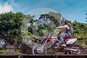 Man driving riding over old bridge in Guatemalan Mountains