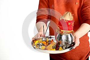 Photo of man hand is holding pooja thali for navratri festival