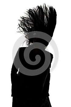 Photo of man's silhouette with blowing hair