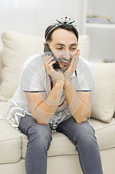 Photo of man talking over the phone with positive espression.