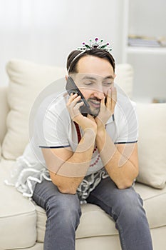 Photo of man talking over the phone with positive espression.