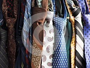 . Photo of many different ties neckties. Second hand.