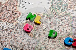 Photo of map of european countries and colorful letters on the w