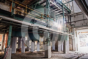 Photo of a massive industrial complex with a maze of pipes and machinery photo