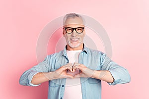 Photo of mature man show fingers heart symbol love romantic valentine day eyewear isolated over pink color background