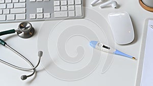 Photo of Medical tools putting together on white modern desk.