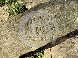 Message in Spanish on a Rock photo