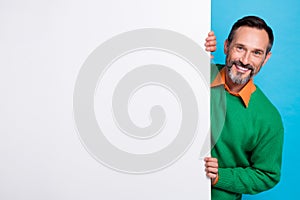 Photo of middle age businessman handsome grey beard hide big banner empty space new vacancy job proposition isolated on