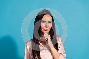 Photo of minded clever woman with straight hairdo dressed silk shirt keep hand on chin think business isolated on blue