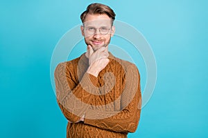 Photo of minded happy positive young man happy good mood think isolated on pastel blue color background