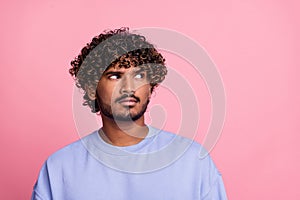 Photo of minded man wear blue clothes look empty space question solution hmm isolated on pink color background