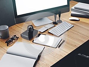 Photo of modern workspace with desktop screen