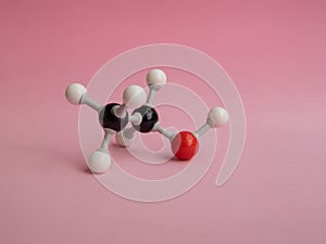 Photo of a molecular atom model  on a pink background