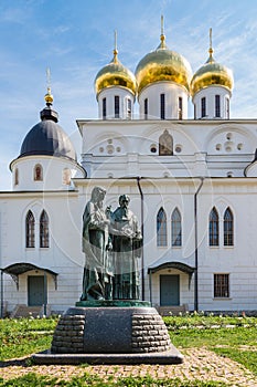 Photo of the monument to Cyril and Methodius near the white Christian chirch