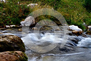 Photo of nature - spring water mountain river shot with long exposure and the pretty rocky creek on North Caucasus