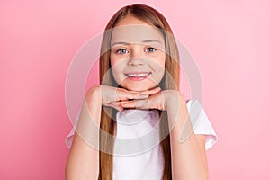 Photo of nice blond small girl hands face wear white t-shirt isolated on pink color background