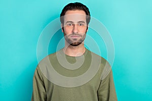 Photo of nice brunet man wear green shirt isolated on teal color background