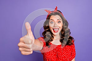Photo of nice charming good cute girl thumbing up for you to get some respect from her while isolated with violet