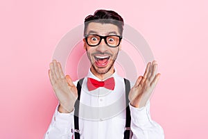 Photo of nice impressed brown hair guy wear spectacles white shirt isolated on pastel pink color background