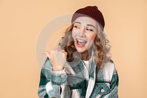 Photo of nice laughing woman pointing fingers and looking aside
