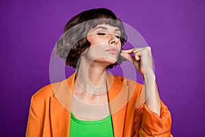 Photo of nice millennial brunette lady italian gesture wear orange blazer top  on violet color background