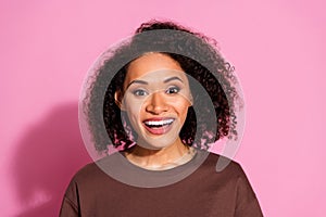 Photo of nice young girl toothy smile wear brown t-shirt isolated on pink color background