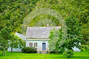 Photo of a Norwegian rural farm house with shed