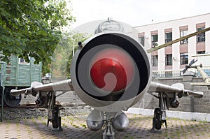 On the photo the nose of a military jet plane